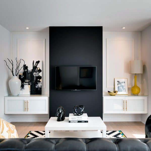 Cool TV area black accent wall. 
